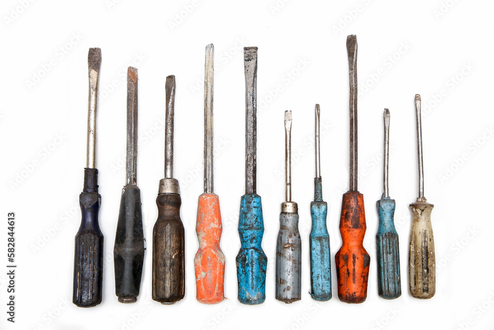 The set of aged and worn screwdrivers isolated in a white background. Old, but still useful. The set of aged and worn screwdrivers isolated in a white background. Old, but still useful.