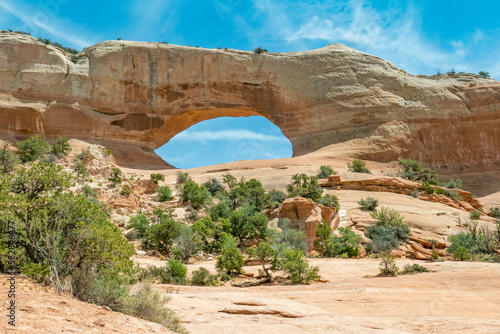 Wilson Arch in a semi desert landscape in Moab Utah photo