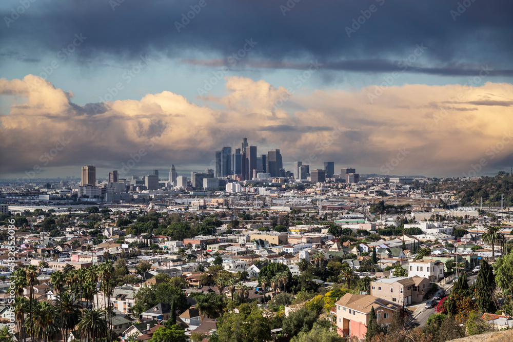 Hilltop view of downtown Los Angeles California with storm clouds.