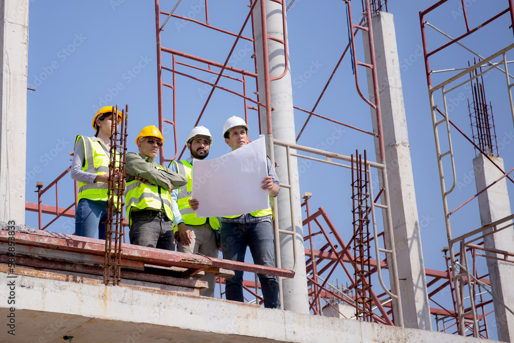 Team group of contractor and architect with foreman explaining about scheme building site for planning project to worker and looking blueprint, construction site, development and structure. Team group of contractor and architect with foreman explaining about scheme building site for planning project to worker and looking blueprint, construction site, development and structure.