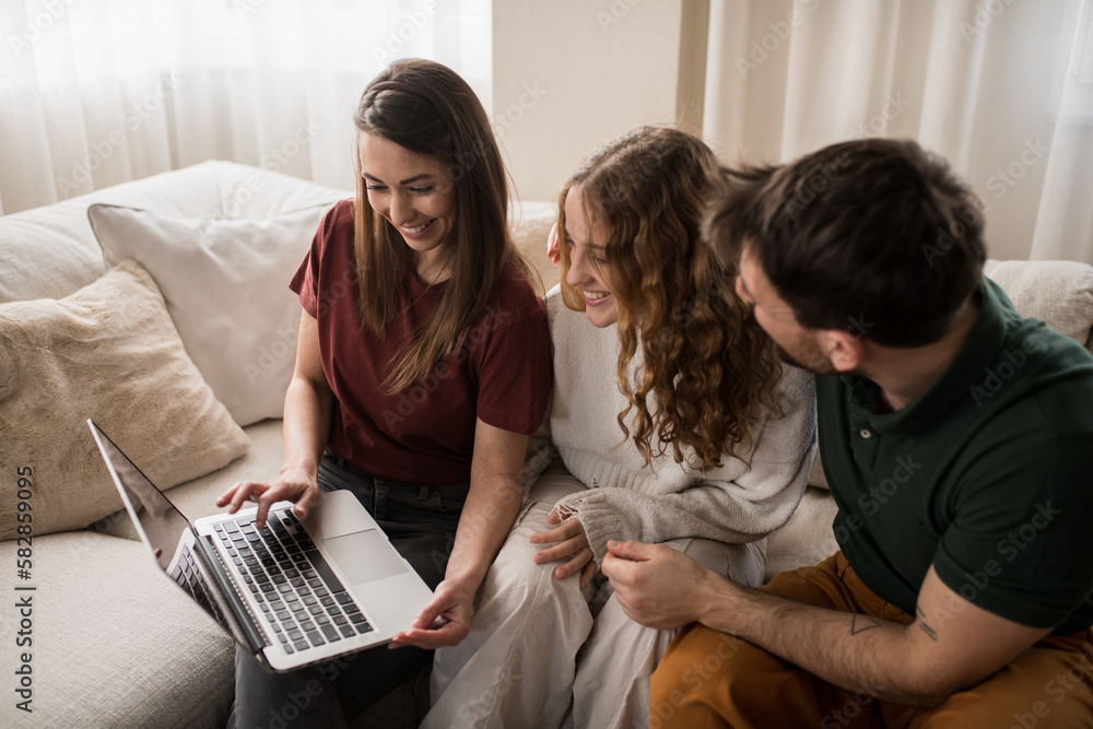 Portrait of a happy family of three using laptop at home. Portrait of a happy family of three using laptop at home.