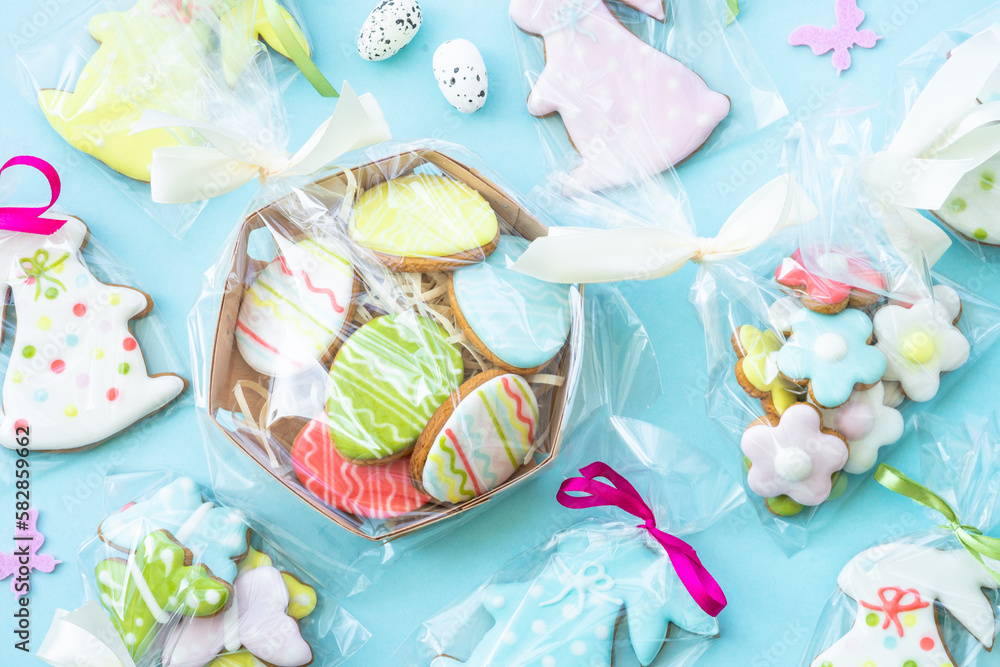 Easter gingerbread cookies on blue. Idea for easter gift, present. Flat lay with copy space. Easter gingerbread cookies on blue. Idea for easter gift, present. Flat lay with copy space.