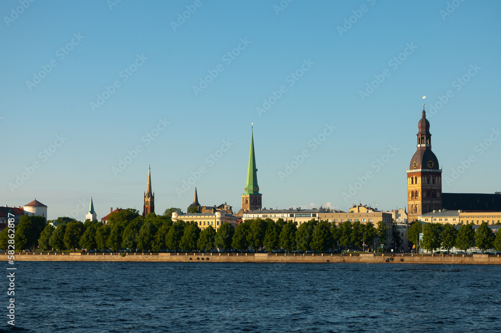 Riga. in the photo, the panorama of the city of Riga, the river in the foreground, the blue sky in the background