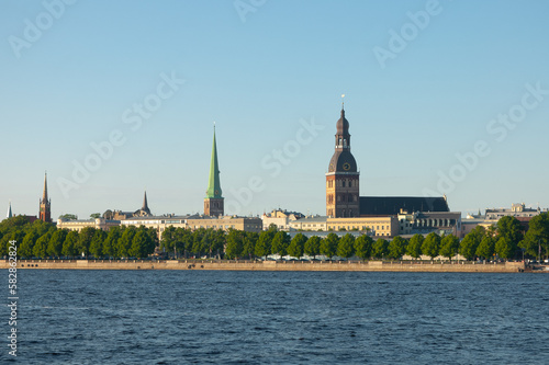 Riga. in the photo, the panorama of the city of Riga, the river in the foreground, the blue sky in the background