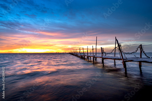 Wooden bridge on the beach at dawn in Phu Quoc island, Vietnam. Long exposure time © Quang