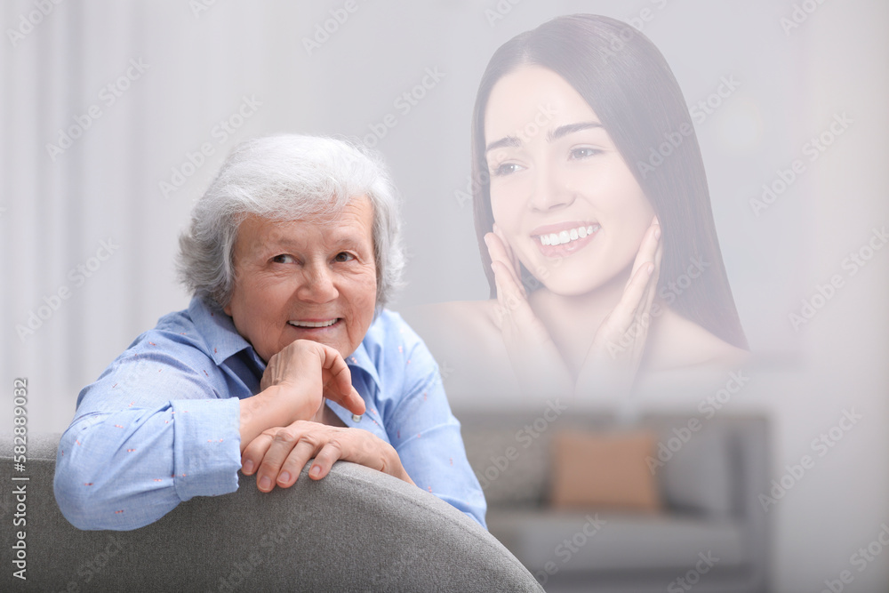 Mature woman remembering old times. Translucent picture of young girl showing her in her youth Mature woman remembering old times. Translucent picture of young girl showing her in her youth