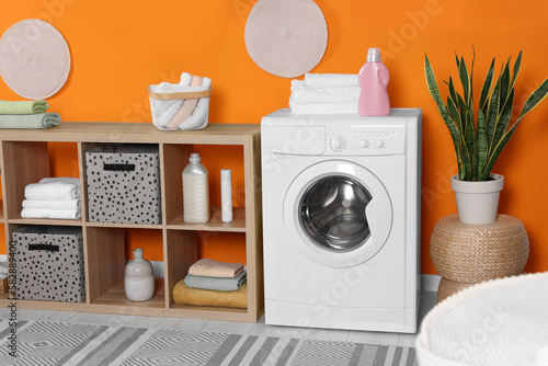 Stylish laundry room with washing machine. Interior design © New Africa
