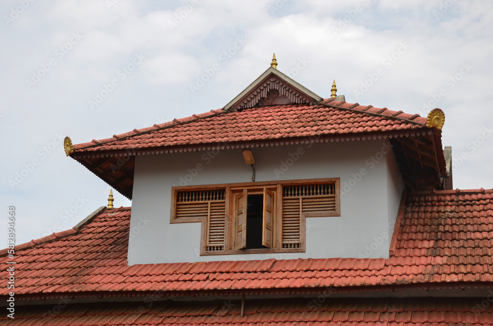 Traditional tiled roof house in Kerala, India Traditional tiled roof house in Kerala, India