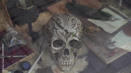 Scull. A human skull lies on a shop window.