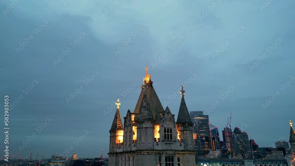 Dolly in pedestal up drone shot of the highest part of the Tower Bridge