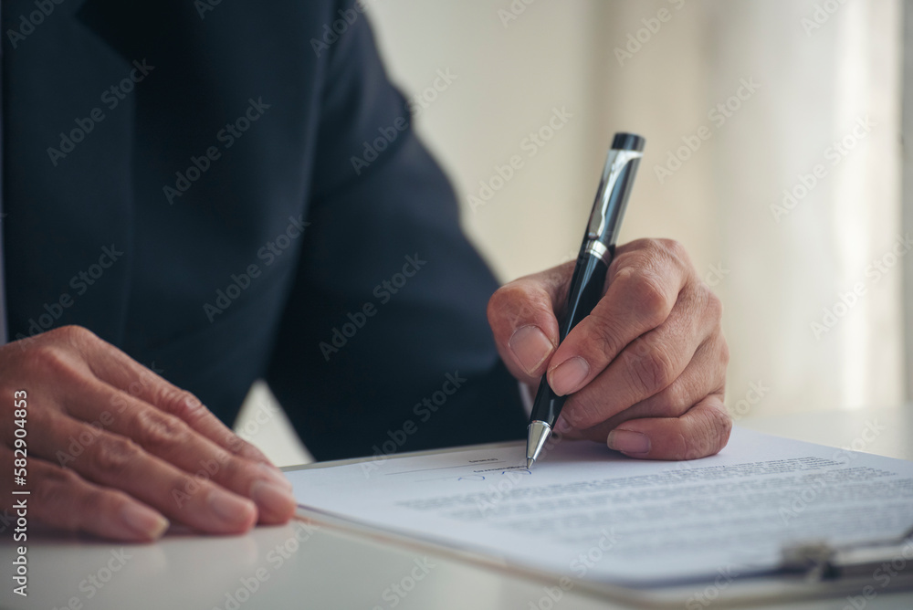 Asian business man using pen signing on new contract to starting projects in conference room. Close up manager businessman hands sign contract working meeting. Business agreement concepts. Asian business man using pen signing on new contract to starting projects in conference room. Close up manager businessman hands sign contract working meeting. Business agreement concepts.