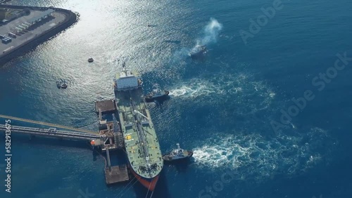 Cargo terminal Jeddah Port, Saudi Arabia. Aerial view of a tanker refueling with oil.