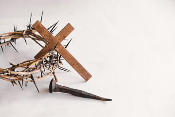 Jesus Crown Thorns and nails and cross on a white background. Crucifixion Of Jesus Christ. Passion Of Jesus Christ. Concept for faith, spirituality and religion. Easter Day