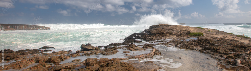 Big waves hitting shore at Laie Point coastline at Kaawa on the North Shore of Oahu Hawaii United States