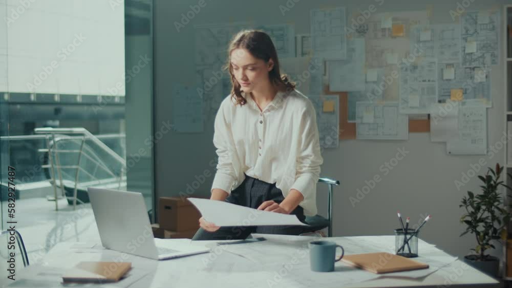 A Female Architect in Her Modern Office Creates Innovative Designs Using Advanced Technologies and Tools. She Works On Blueprints, Sketches and Technical Equipment to Bring Her Creative Vision to Life A Female Architect in Her Modern Office Creates Innovative Designs Using Advanced Technologies and Tools. She Works On Blueprints, Sketches and Technical Equipment to Bring Her Creative Vision to Life