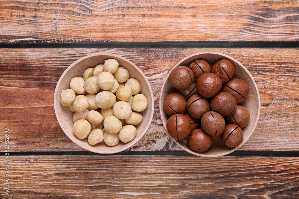 Delicious organic Macadamia nuts on wooden table, flat lay Delicious organic Macadamia nuts on wooden table, flat lay