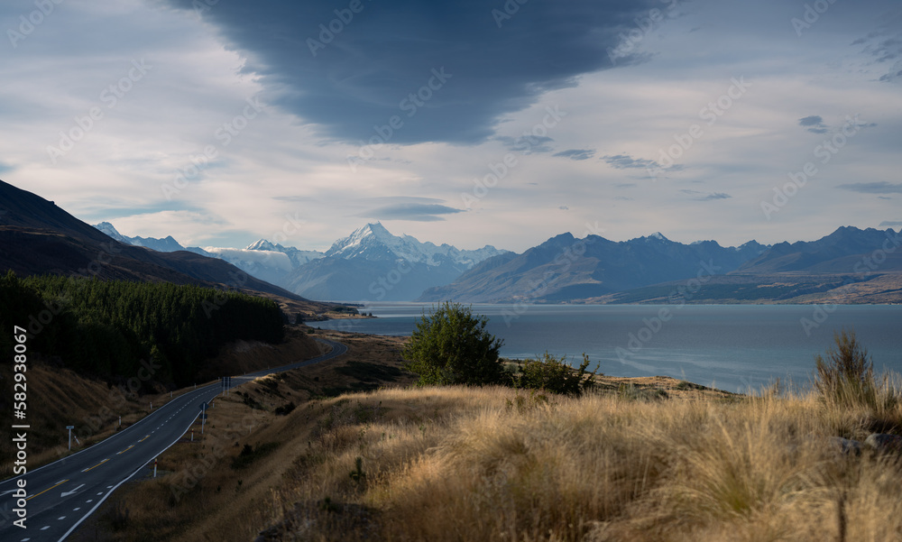 New Zealand landscape with mountains and lake with dramatic sky