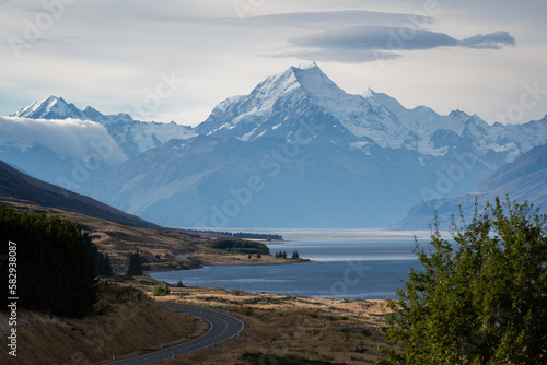 New Zealand landscape with mountains and lake with dramatic sky