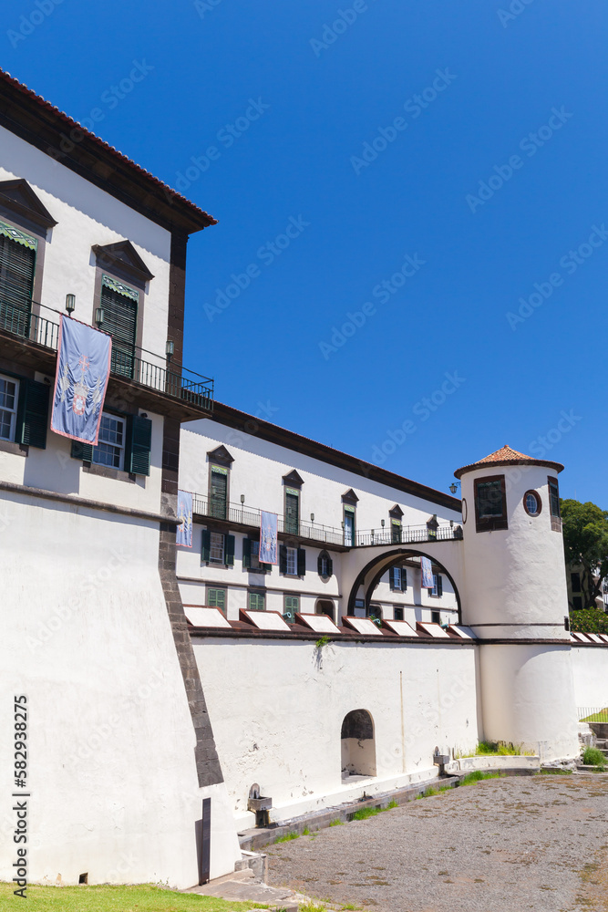 Palace of Sao Lourenco on a sunny summer day. Vertical street view