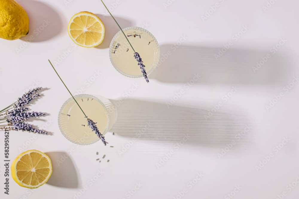 Still life with lavender infused lemonade and lemons on the white table - obrazy, fototapety, plakaty 
