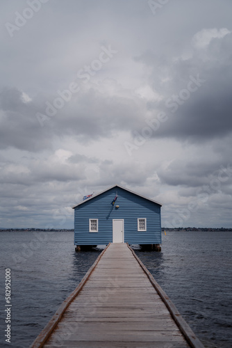 blue cabin by the water