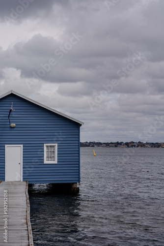 blue fisherman house by the water