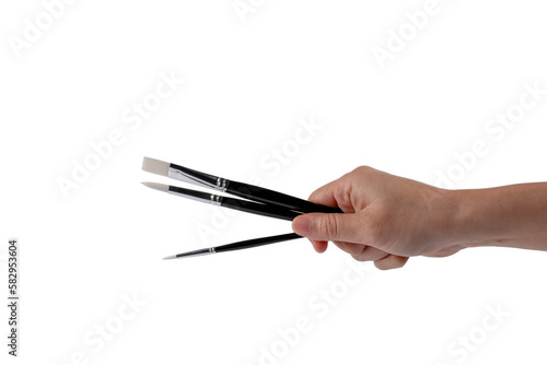 Hand using a little paintbrush isolated on a transparent background