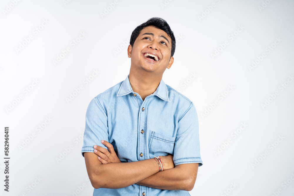 portrait of a smiling Asian man with crossed arms on an isolated background portrait of a smiling Asian man with crossed arms on an isolated background