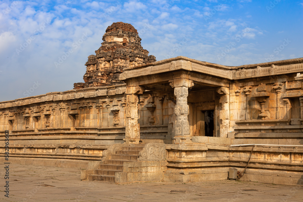 Medieval stone architecture structure with stone artwork at the Vijaya Vittala temple complex at Hampi, Karnataka, India.