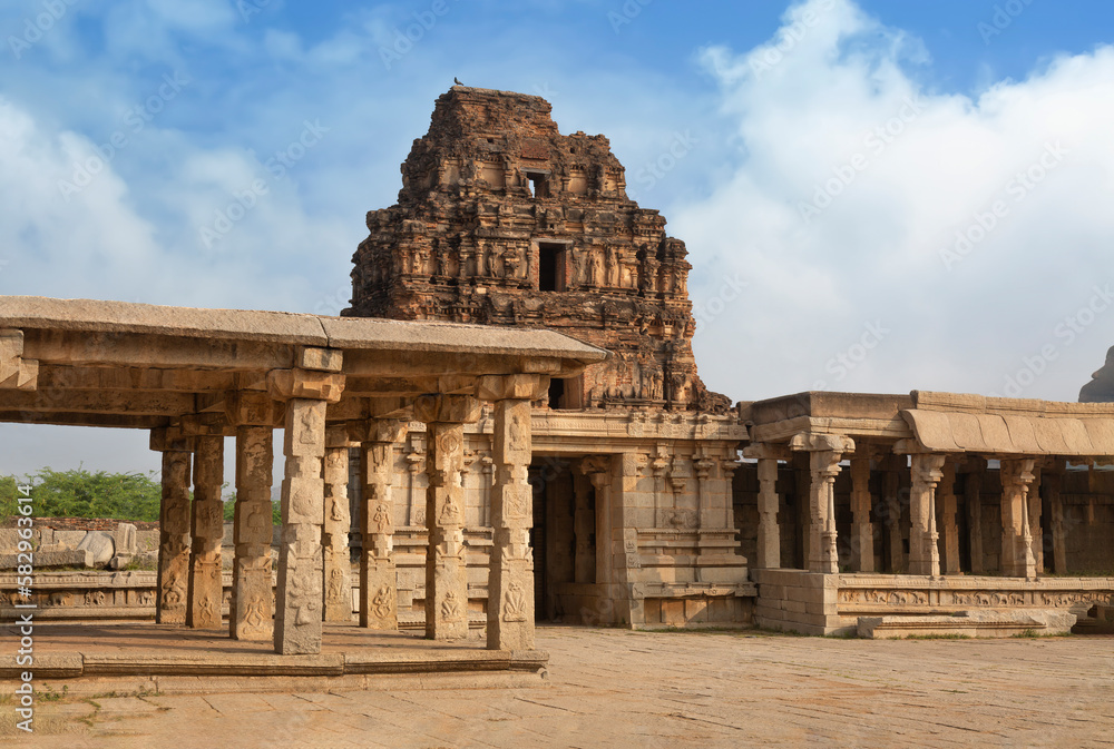 Medieval stone architecture structure with stone artwork at the Vijaya Vittala temple complex at Hampi, Karnataka, India.