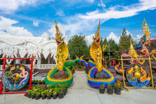The King Serpent and Queen Serpent statue at Wat Don Khanak, Nakhon Pathom, Thailand photo
