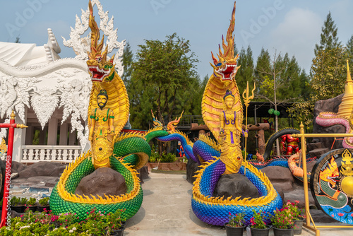 The King Serpent and Queen Serpent statue at Wat Don Khanak, Nakhon Pathom, Thailand photo