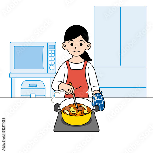 カレーを煮る主婦