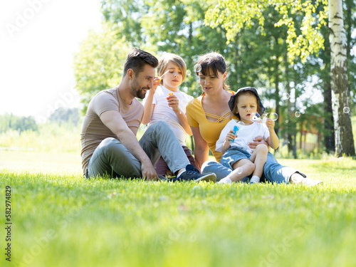 Family playing with soap bubble