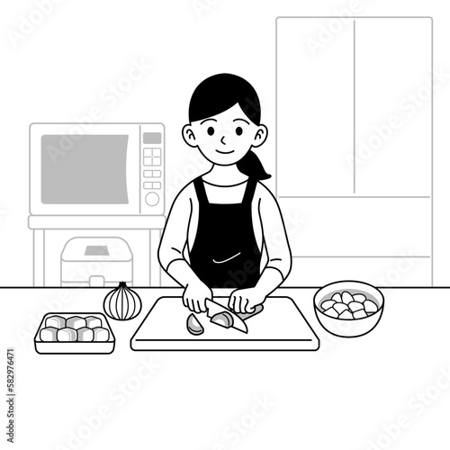 野菜を切る主婦　モノクロ