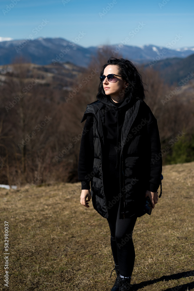 Beautiful smiling woman in the early spring park Beautiful smiling woman in the early spring park
