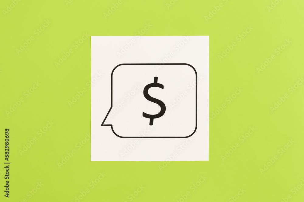 Dollar sign on white paper on green background, flat lay. Dollar sign on white paper on green background, flat lay.