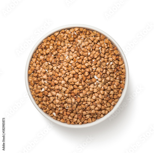 Bowl of buckwheat isolated on white background. Straight top view
