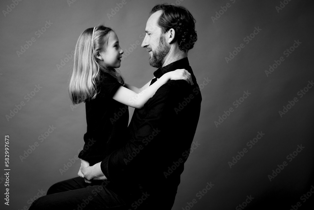 Father and daughter face to face in studio Father and daughter face to face in studio