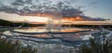 Reflections over the terraces of Great Fountain Geyser at sunset, Yellowstone National Park, Wyoming, USA