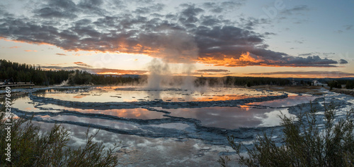 Reflections over the terraces of Great Fountain Geyser at sunset, Yellowstone National Park, Wyoming, USA