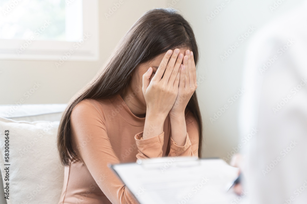 Young woman in a mental therapy session talking with a psychologist in the office. Young woman in a mental therapy session talking with a psychologist in the office.
