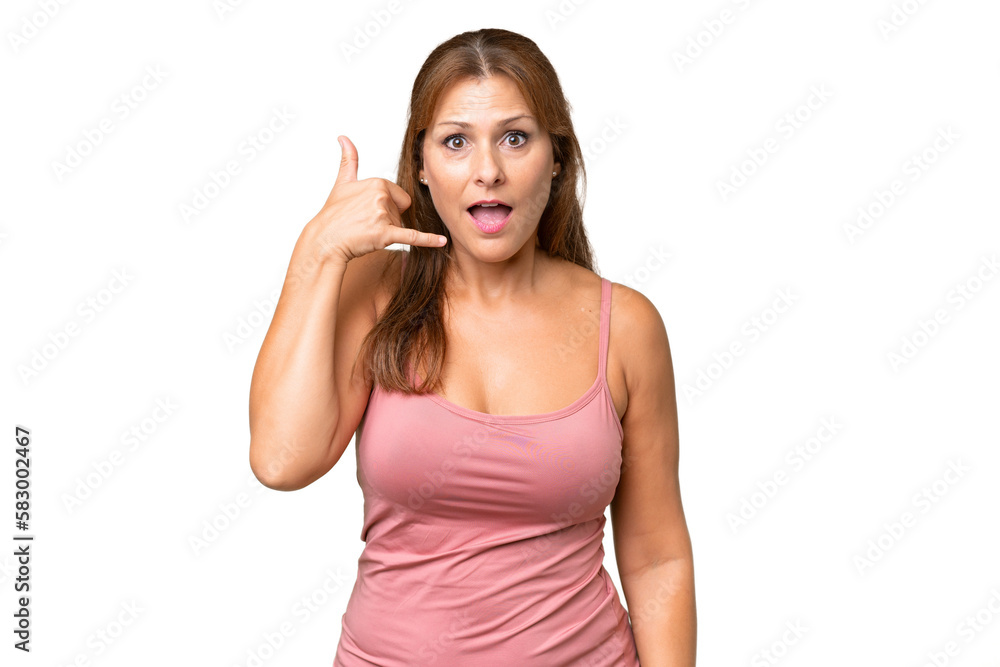 Middle-aged caucasian woman over isolated background making phone gesture. Call me back sign Middle-aged caucasian woman over isolated background making phone gesture. Call me back sign