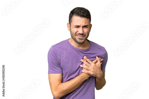 Young handsome caucasian man over isolated background having a pain in the heart