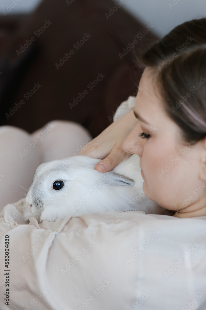 Woman with cute rabbit at home Woman with cute rabbit at home