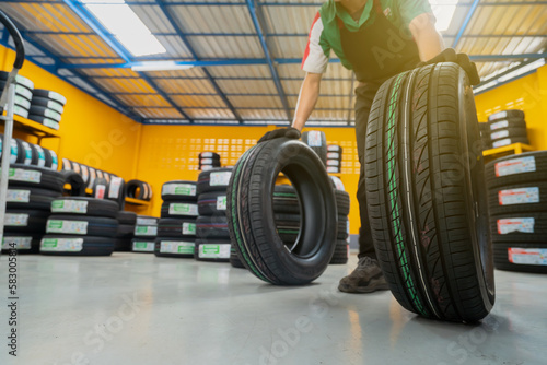 Image of the tire warehouse of the new tire repair service center © Phoophinyo