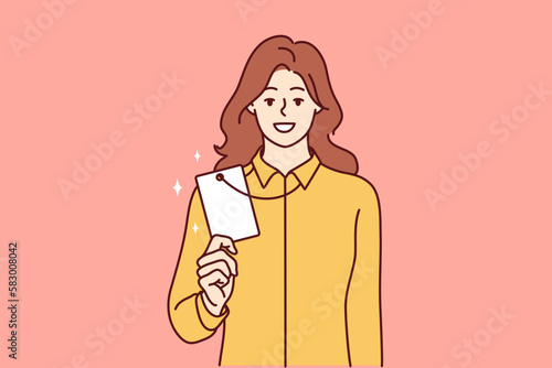 Successful woman demonstrates badge or ID card hanging around neck and giving access to restricted office space. Girl office worker with corporate designed to identify corporation employees 