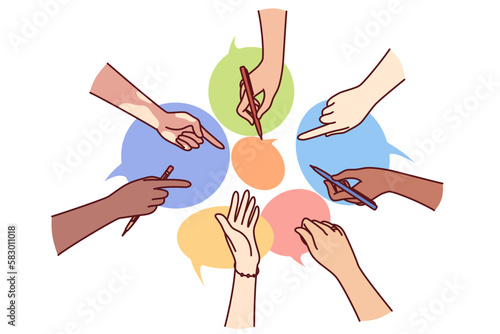 Hands of diverse people near dialogue clouds metaphor for collective communication in instant messengers or chats. Coworking and collaboration in teamwork for brainstorming and searching for ideas 