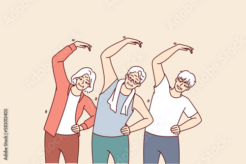 Group of elderly people do gymnastics and lead active lifestyle wishing to have good health. Elderly men and women are exercising in nursing home doing stretching and daily fitness exercises 