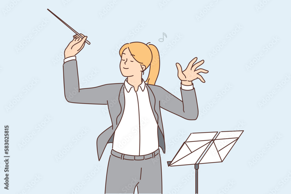 Female conductor leading orchestra Female conductor leading orchestra